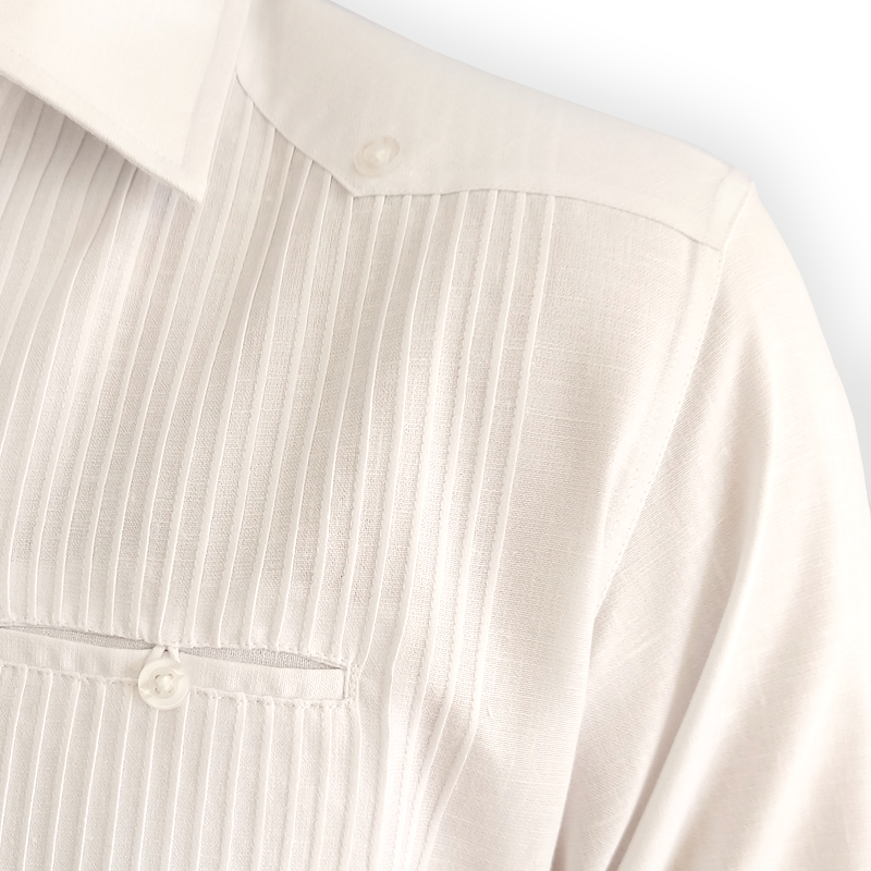 Close-up of 100% cotton fabric on white presidential guayabera