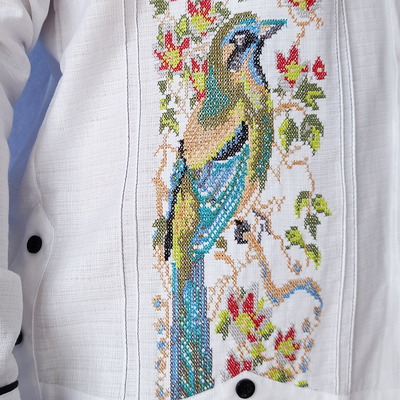 Close-up of Mayan Toh bird embroidery on white guayabera – Casa Habana craftsmanship