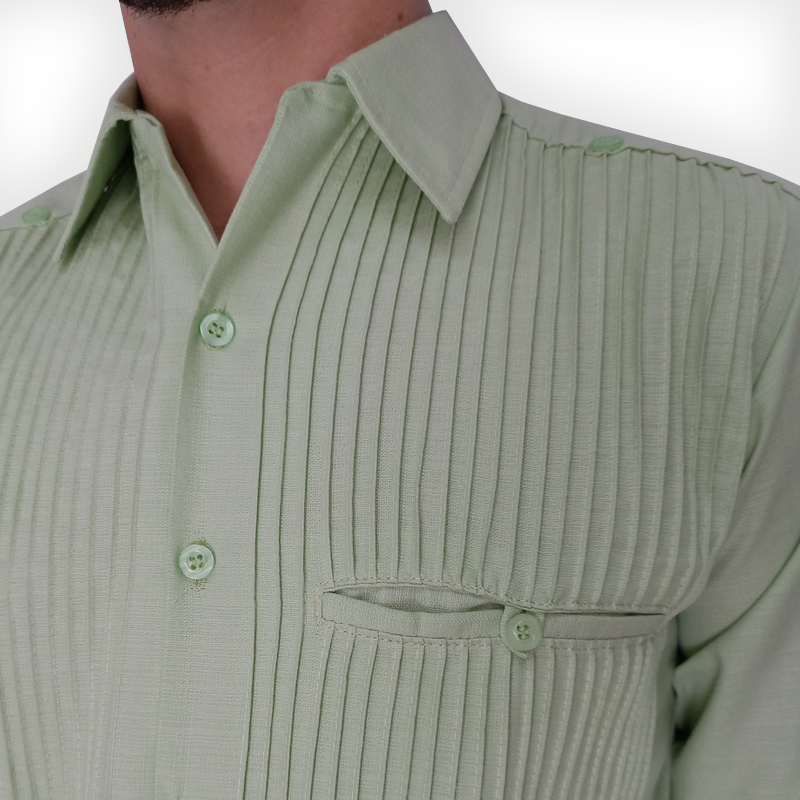 Close-up of apple green guayabera front pockets and button details