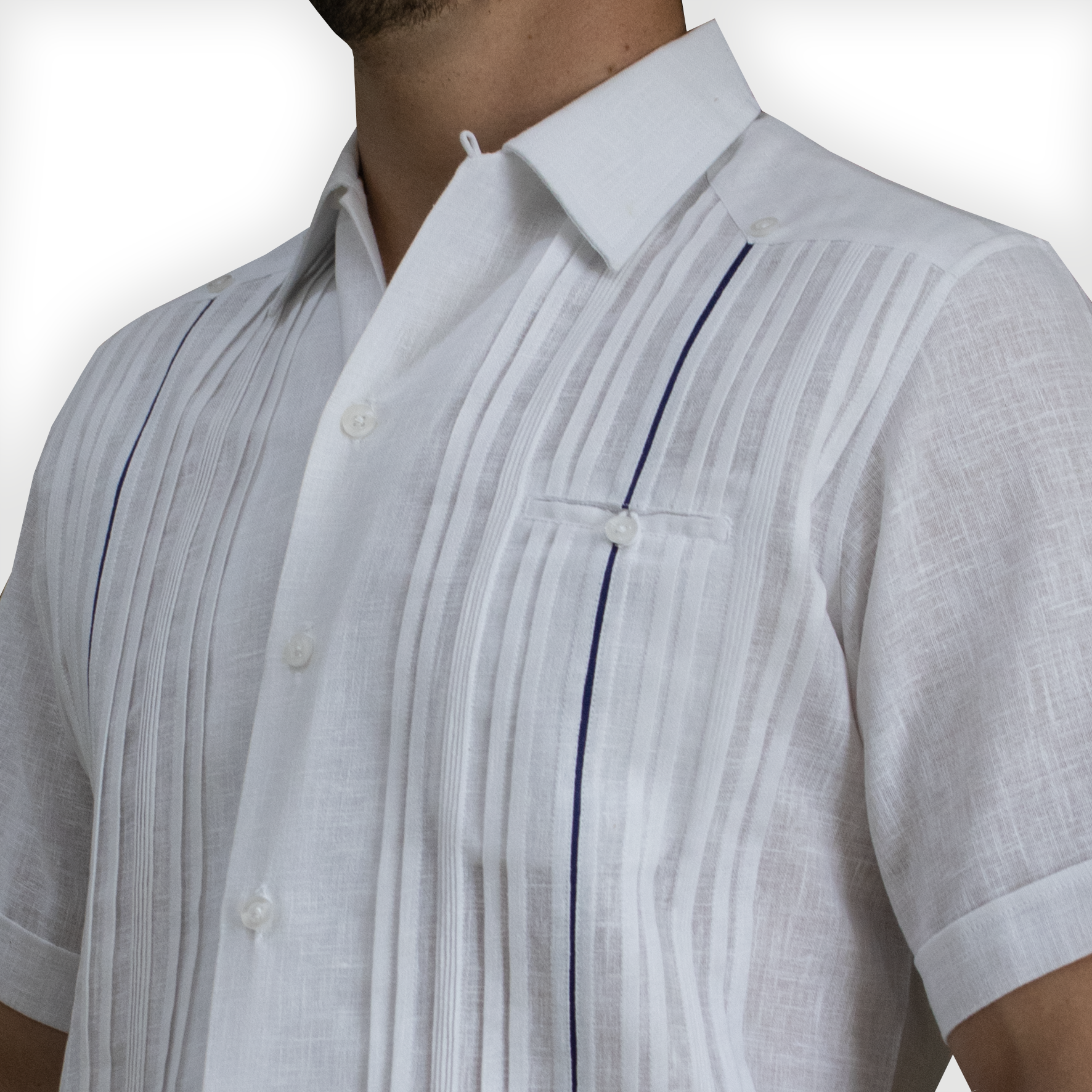 Close-up of blue trim detail on luxury white short-sleeve guayabera