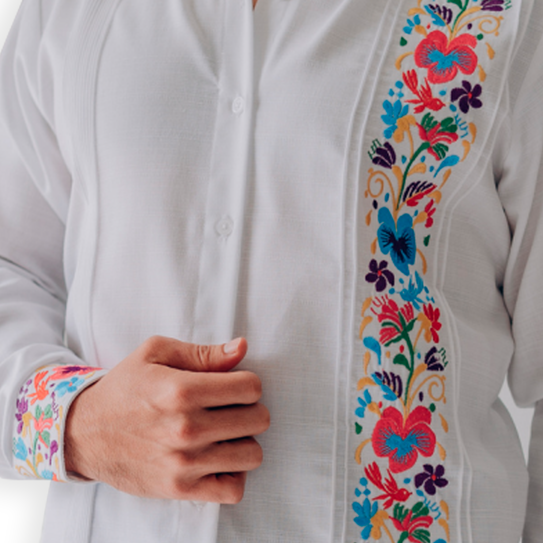 Close-up of floral embroidery on men’s guayabera shirt
