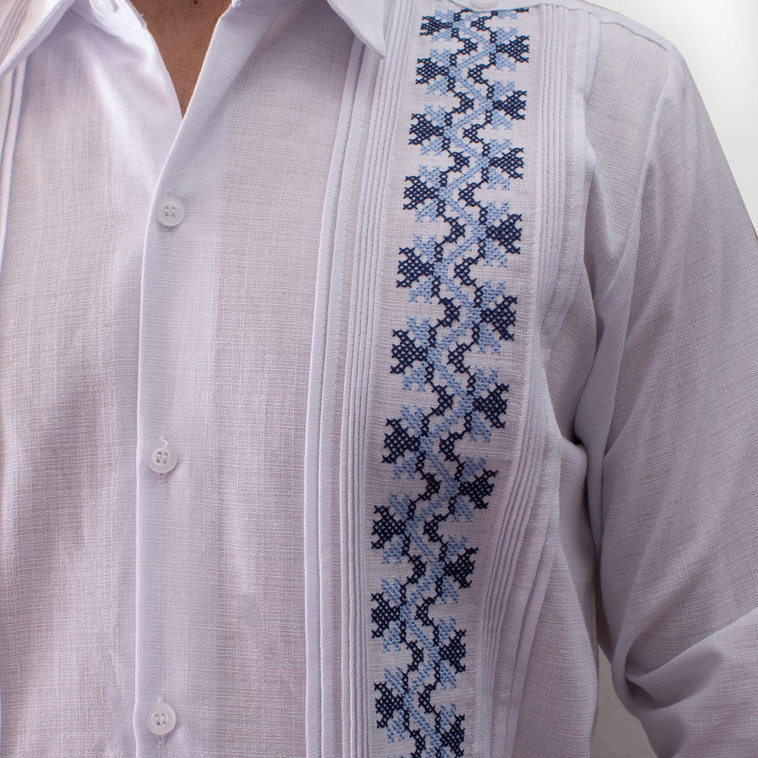 Close-up of hand-stitched cross-stitch embroidery on white long-sleeve guayabera – Casa Habana craftsmanship
