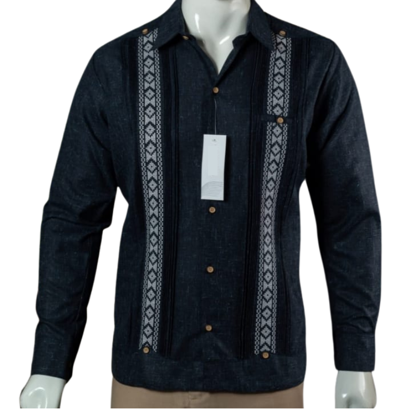 Close-up of handmade Mayan embroidery on navy linen guayabera