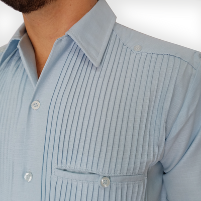 Close-up of light blue short sleeve guayabera pleats and buttons