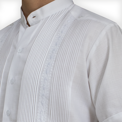 Close-up of mandarin collar and white embroidery on short-sleeve guayabera