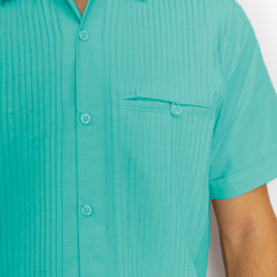Close-up of mint green guayabera fabric and buttons