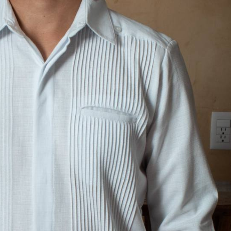 Close-up of presidential white guayabera fabric and fine stitching – Casa Habana craftsmanship