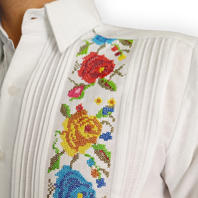 Close-up of tropical floral embroidery on white guayabera – Casa Habana craftsmanship