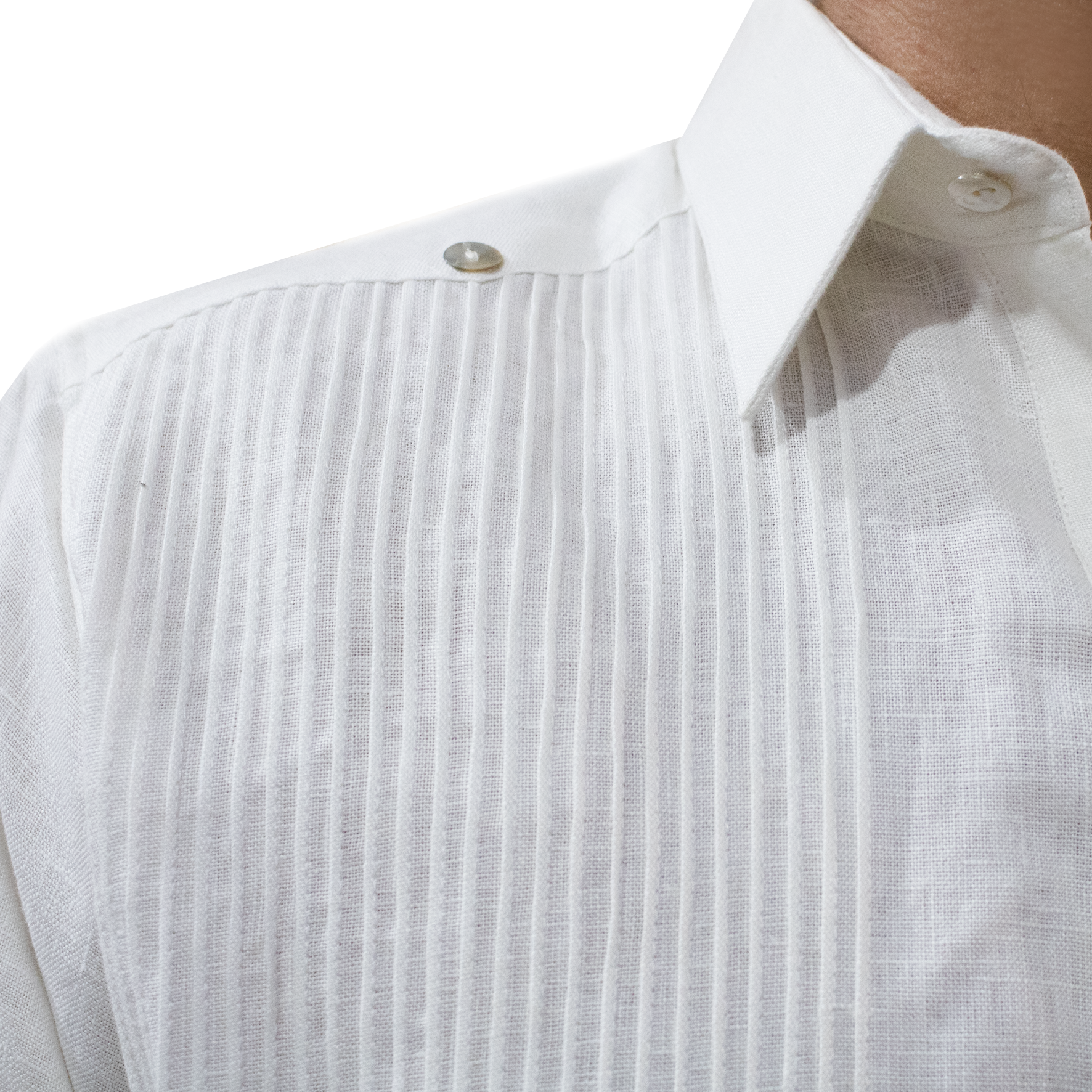 Close-up of white embroidery on men’s white linen guayabera