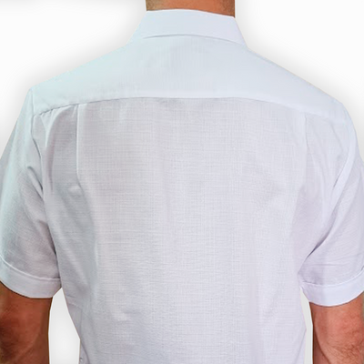 Close-up of white embroidery on short-sleeve guayabera