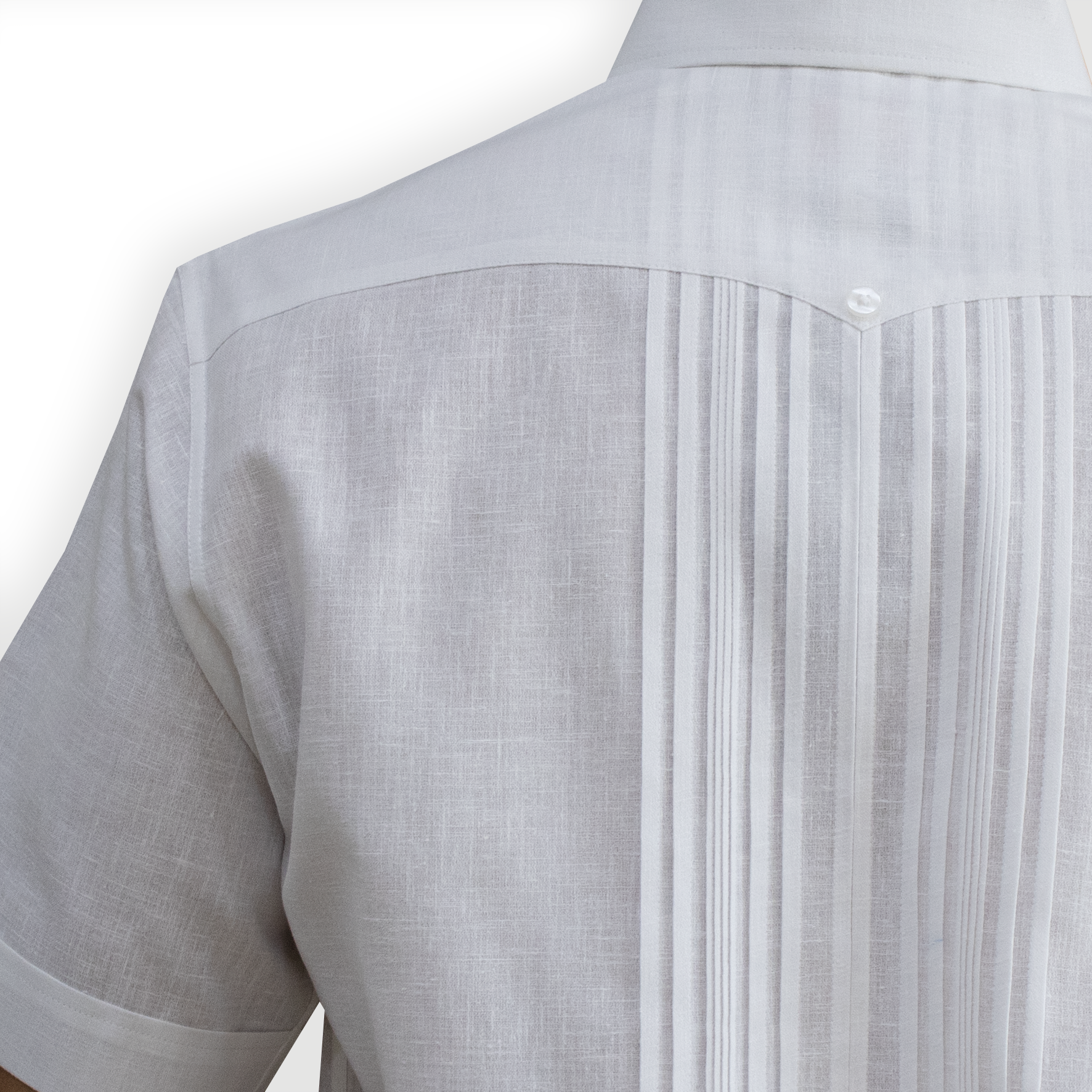 Close-up of white guayabera pleats and buttons – Casa Habana craftsmanship