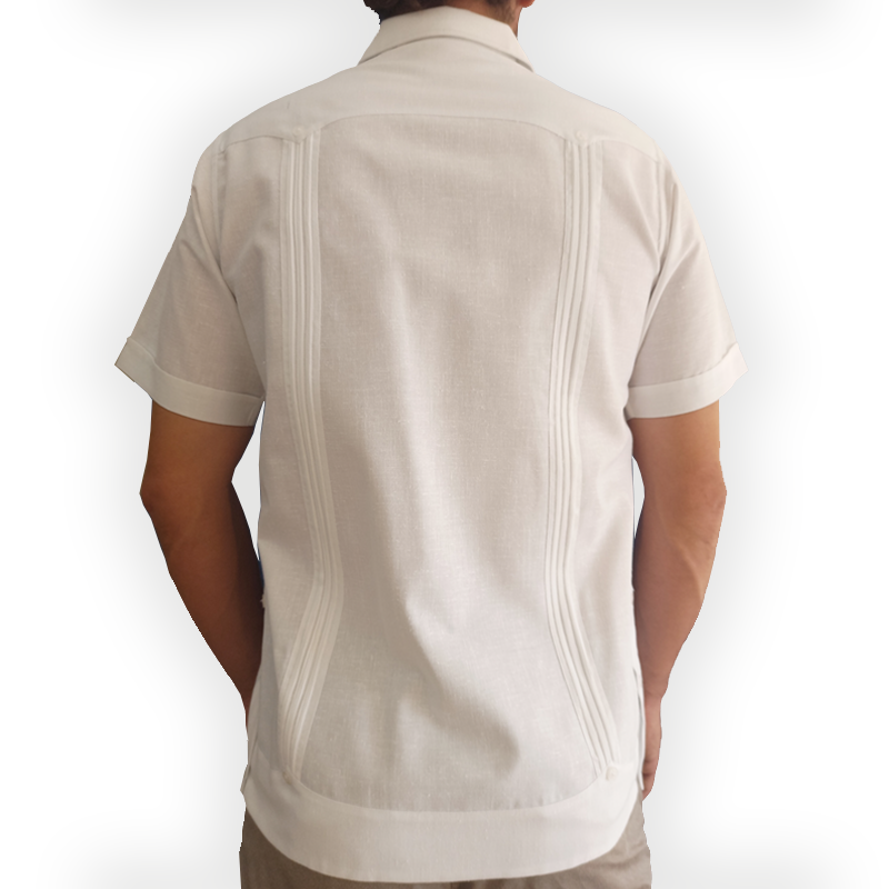 Close-up of white short-sleeve Cuban guayabera pleats and buttons – Casa Habana craftsmanship
