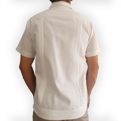 Close-up of white short-sleeve Cuban guayabera pleats and buttons – Casa Habana craftsmanship