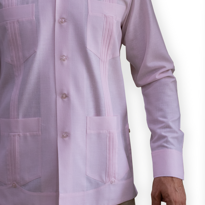 Detail of four functional pockets on Cuban pink long sleeve guayabera