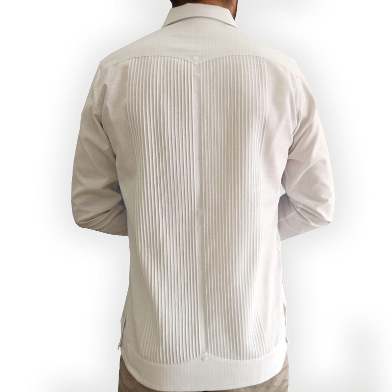 Elegant man wearing White Presidential Guayabera with beige trousers