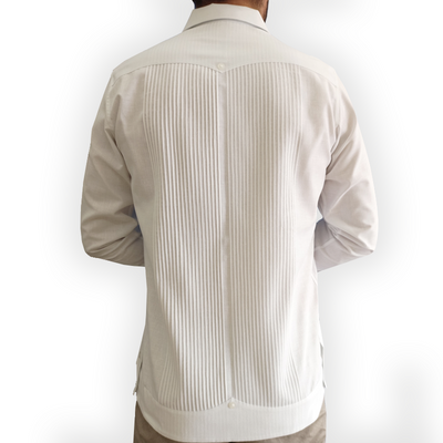 Elegant man wearing White Presidential Guayabera with beige trousers