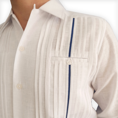 Groom wearing luxury white long-sleeve wedding guayabera with blue trim