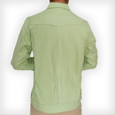 Man wearing apple green long sleeve guayabera with beige trousers