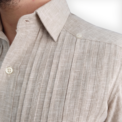 Man wearing beige guayabera shirt