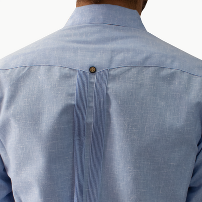 Man wearing blue embroidered long sleeve guayabera