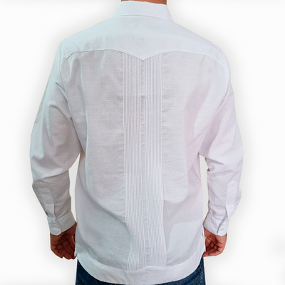 Man wearing blue floral guayabera at a formal summer event