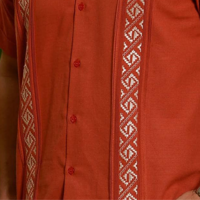 Man wearing burnt orange guayabera shirt