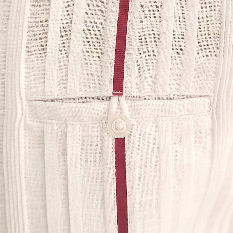 Man wearing elegant white long-sleeve guayabera with red trim – Casa Habana Collection