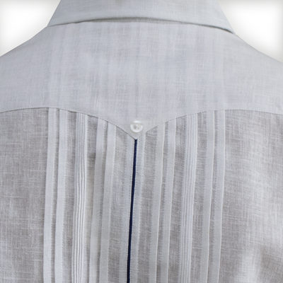 Man wearing luxury white short-sleeve guayabera with blue trim