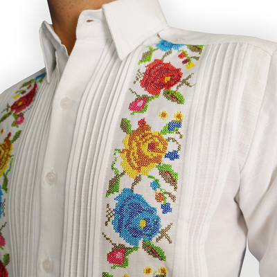 Man wearing white floral embroidered guayabera