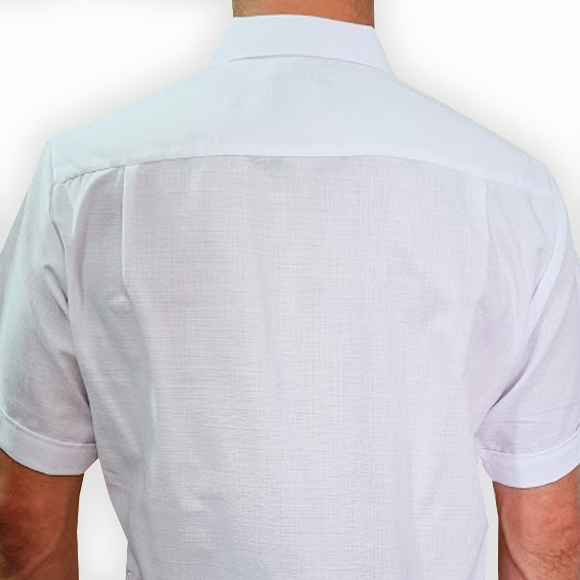 Man wearing white guayabera modern fit with blue embroidery