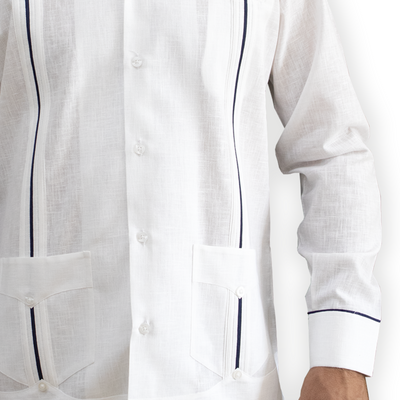 Man wearing white guayabera with blue trim