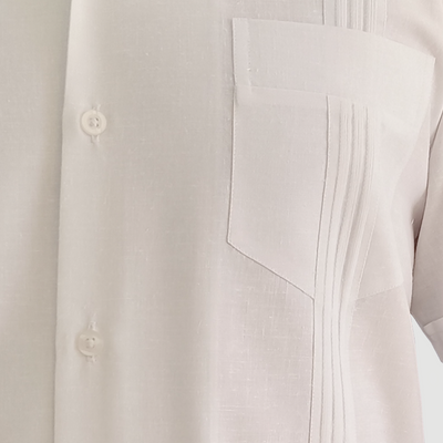 Man wearing white short-sleeve Cuban guayabera