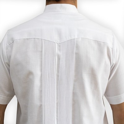 Man wearing white short-sleeve embroidered guayabera