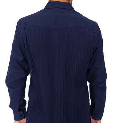 Navy blue guayabera styled with beige trousers