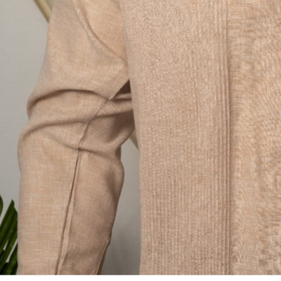 button detail on beige guayabera
