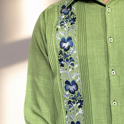close-up of embroidered light green guayabera linen fabric