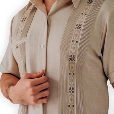 close-up of hand-embroidered beige guayabera fabric