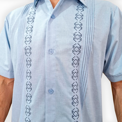 close-up of light blue guayabera fabric texture