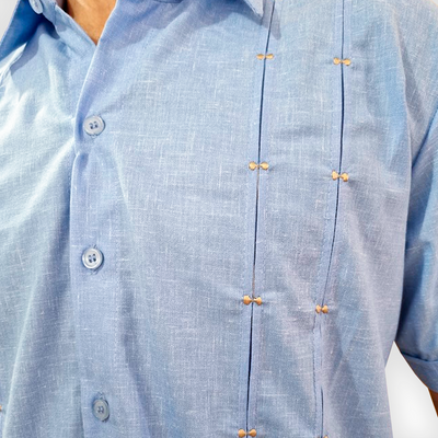 close-up of light blue guayabera shirt fabric texture