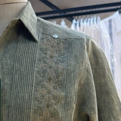 close-up of olive green 100% linen guayabera fabric