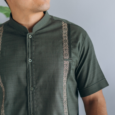 close-up of olive green linen cotton guayabera fabric