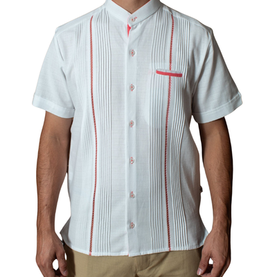 close-up of pink embroidered panels on white guayabera