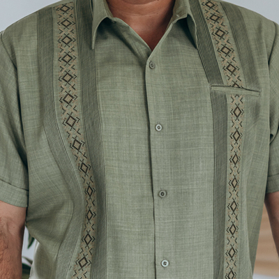 close-up of pistachio green linen cotton guayabera fabric