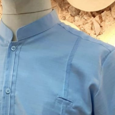 close-up of sky blue linen cotton guayabera fabric