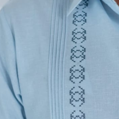 closeup of light blue linen cotton guayabera fabric
