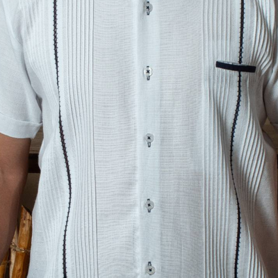 detail of navy embroidery on mandarin collar shirt