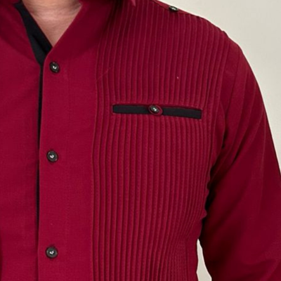 hand-embroidered detail on burgundy guayabera