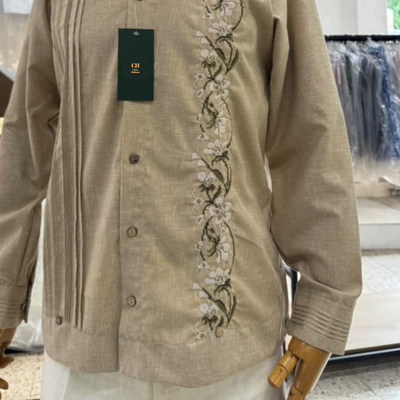 man wearing beige floral embroidered guayabera