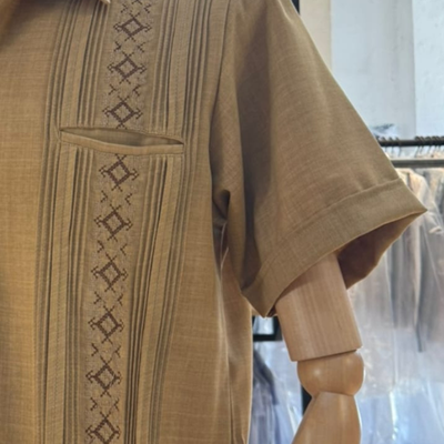 man wearing camel embroidered short sleeve guayabera