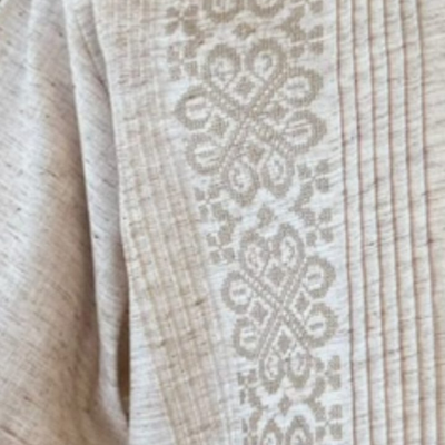 man wearing cream embroidered short sleeve guayabera